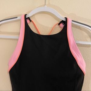 Lululemon black high neck tank top with bright pink and orange detail. Size 6